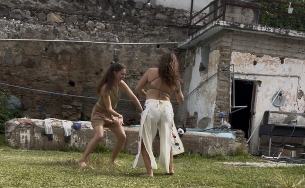 Two people exploring movement together outdoors